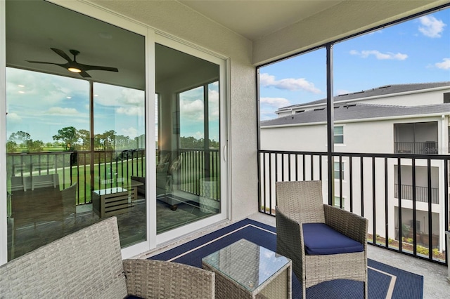 sunroom featuring ceiling fan