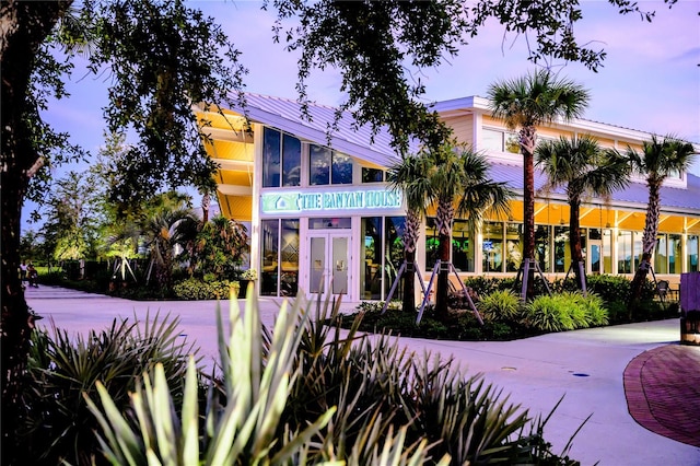 view of outdoor building at dusk