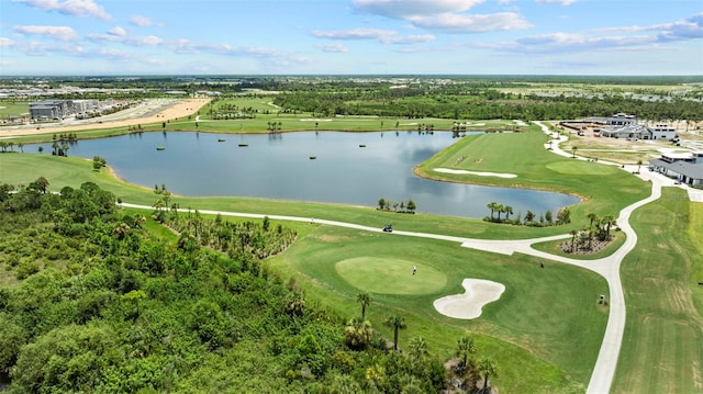 birds eye view of property with a water view and golf course view