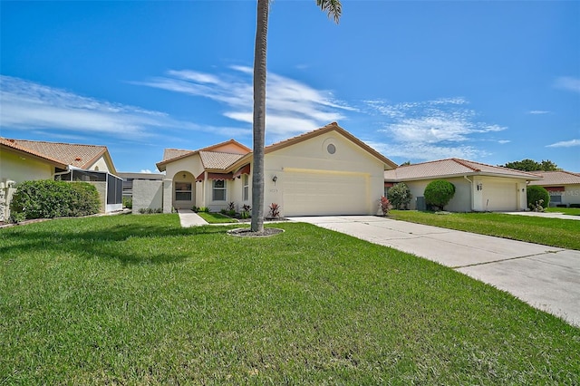 view of front of property with a front yard and a garage