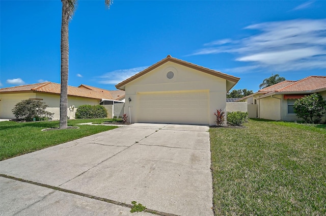 single story home featuring a garage and a front lawn