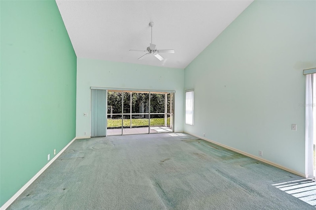 unfurnished room with ceiling fan, carpet, and high vaulted ceiling