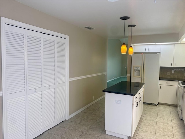 kitchen with white appliances, visible vents, decorative backsplash, dark countertops, and pendant lighting