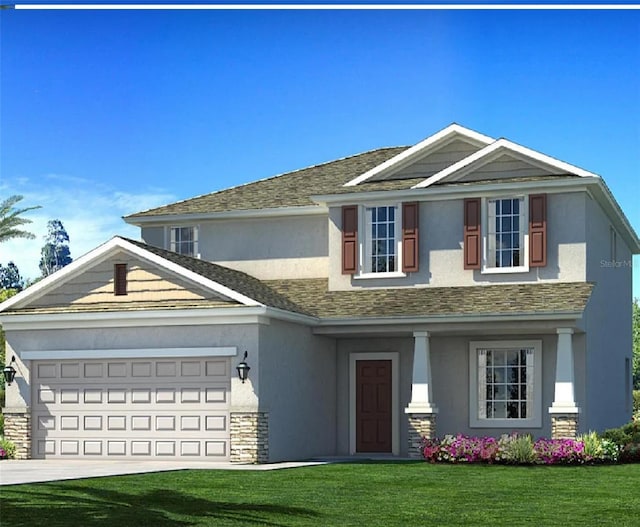 view of front of home featuring a garage and a front lawn