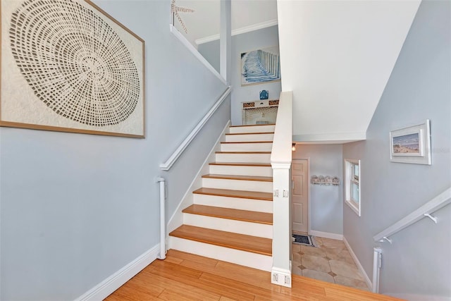 stairs with light hardwood / wood-style flooring