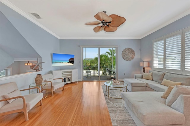 living room featuring ceiling fan, light hardwood / wood-style flooring, and ornamental molding