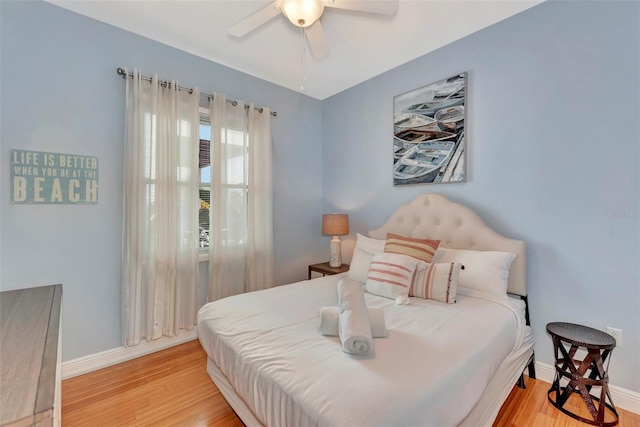 bedroom with light wood-type flooring and ceiling fan