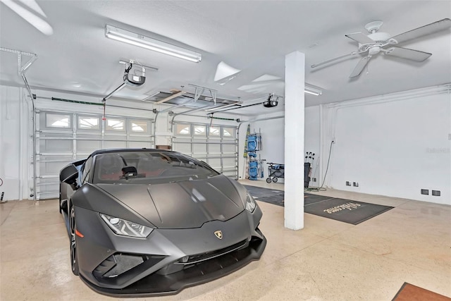 garage featuring a garage door opener and ceiling fan