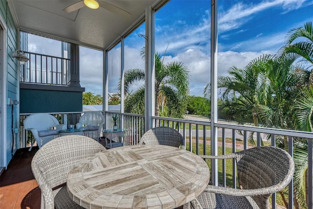 sunroom / solarium with ceiling fan