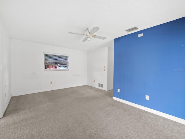 carpeted empty room with ceiling fan