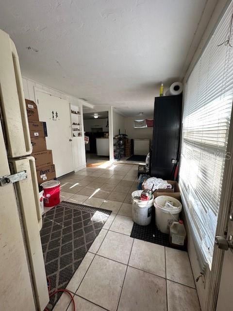 living room with a healthy amount of sunlight and light tile patterned floors