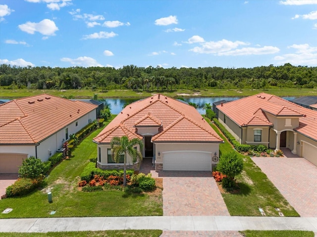 view of front of home featuring a garage and a water view