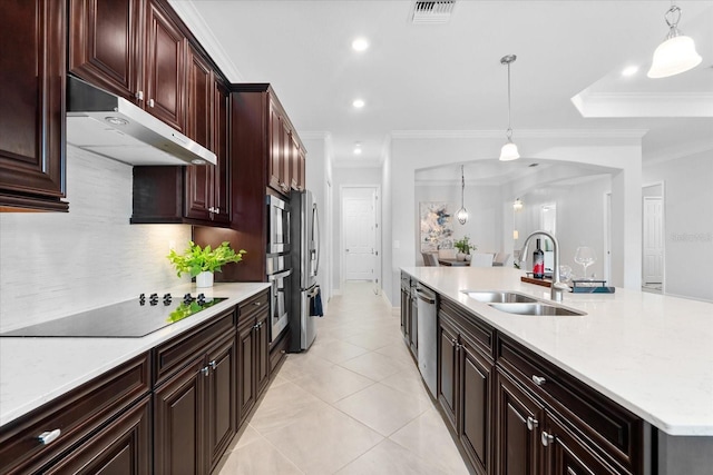 kitchen with pendant lighting, sink, crown molding, light tile patterned floors, and stainless steel appliances