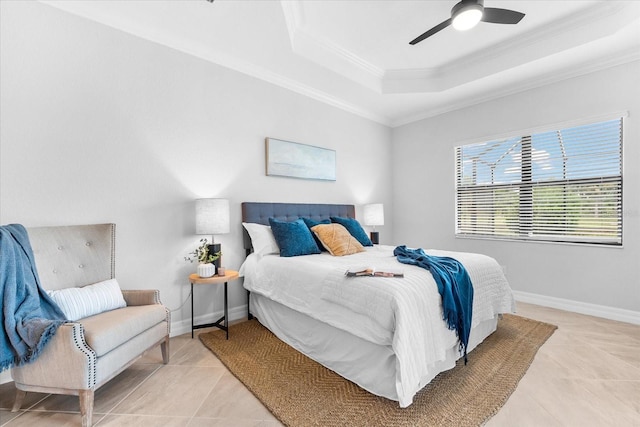 bedroom featuring crown molding, ceiling fan, a tray ceiling, and light tile patterned flooring