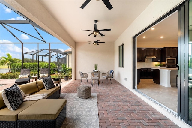 view of patio / terrace with an outdoor living space and ceiling fan