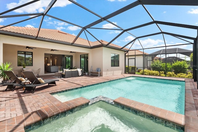 view of swimming pool featuring a patio, an in ground hot tub, ceiling fan, glass enclosure, and an outdoor living space