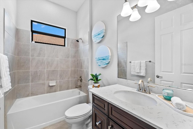 full bathroom featuring vanity, toilet, and tiled shower / bath