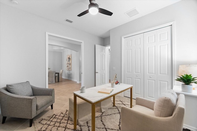 office featuring light tile patterned floors and ceiling fan