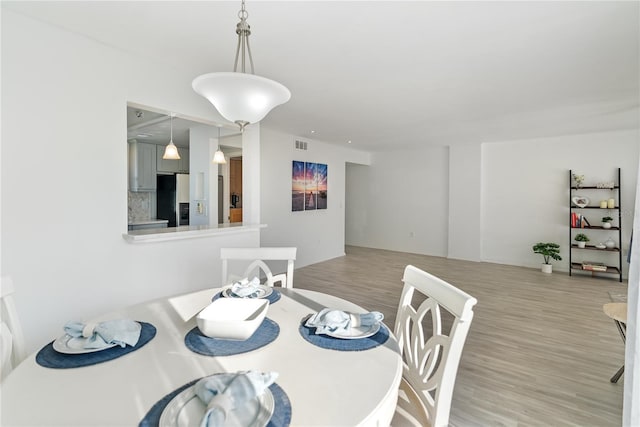 dining area featuring light hardwood / wood-style floors