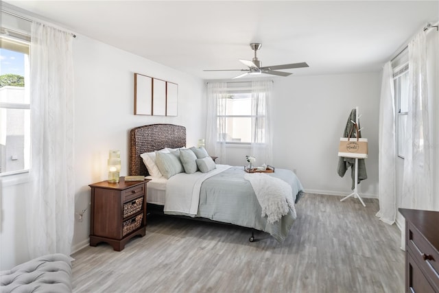 bedroom featuring hardwood / wood-style floors and ceiling fan