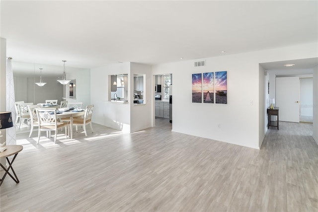 unfurnished living room featuring light hardwood / wood-style flooring