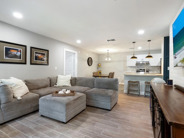 living room featuring a chandelier