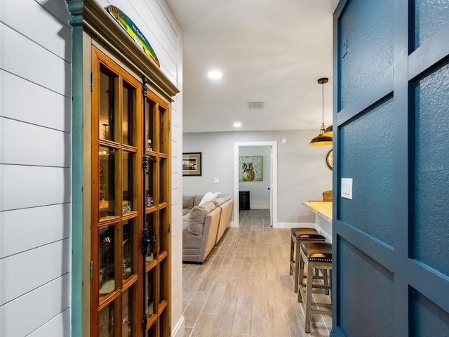 wine cellar featuring light hardwood / wood-style flooring