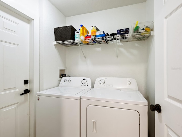 washroom featuring washer and dryer