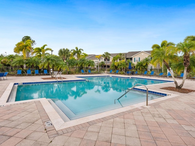 view of swimming pool with a patio area