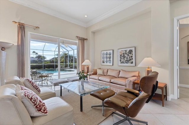 living area with ornamental molding, a sunroom, light tile patterned flooring, and baseboards