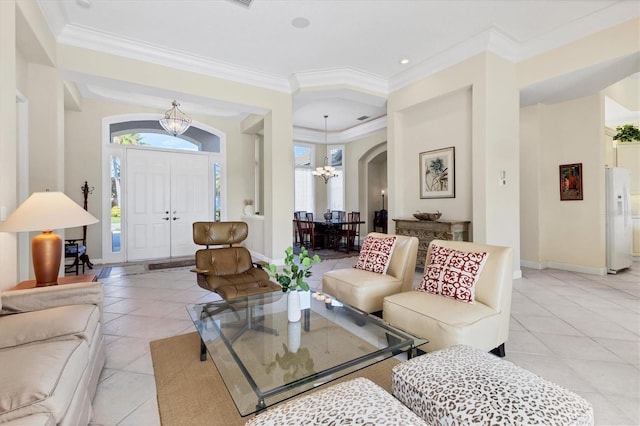 living area with crown molding, light tile patterned floors, baseboards, and a notable chandelier