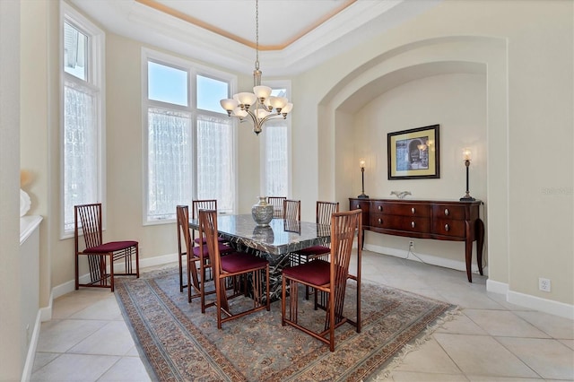 dining room with light tile patterned floors, baseboards, and an inviting chandelier