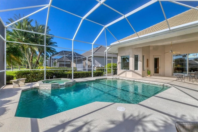 view of pool featuring a lanai, a patio area, a pool with connected hot tub, and a ceiling fan