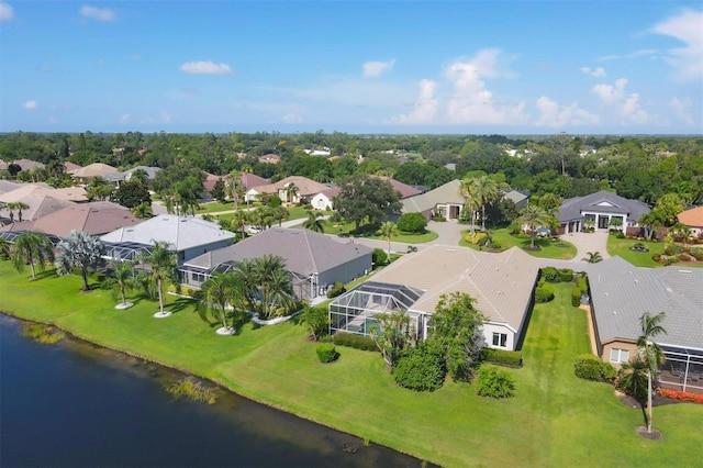 bird's eye view with a residential view and a water view