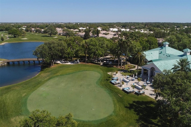 birds eye view of property featuring view of golf course and a water view