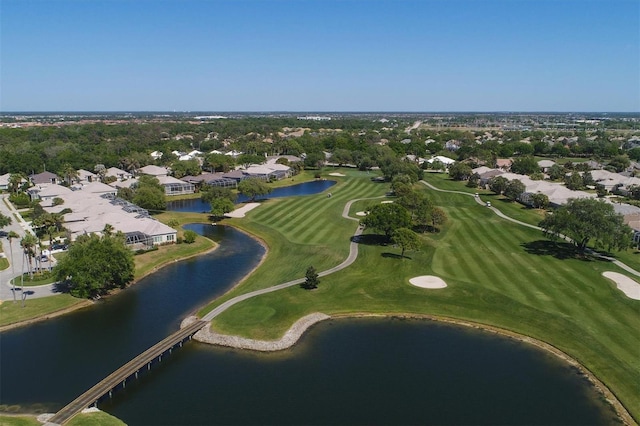 bird's eye view with a residential view, view of golf course, and a water view