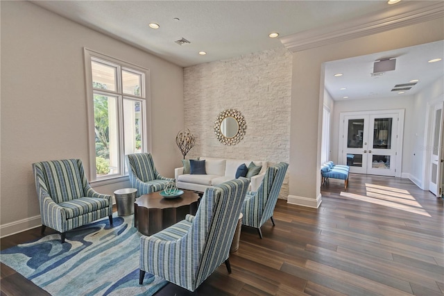 sitting room with baseboards, visible vents, dark wood finished floors, and recessed lighting