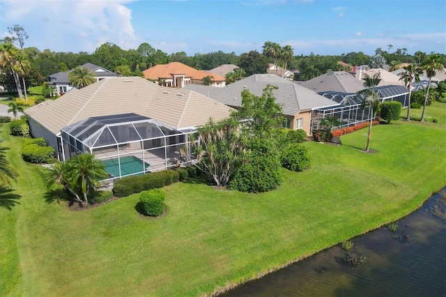 bird's eye view featuring a water view and a residential view