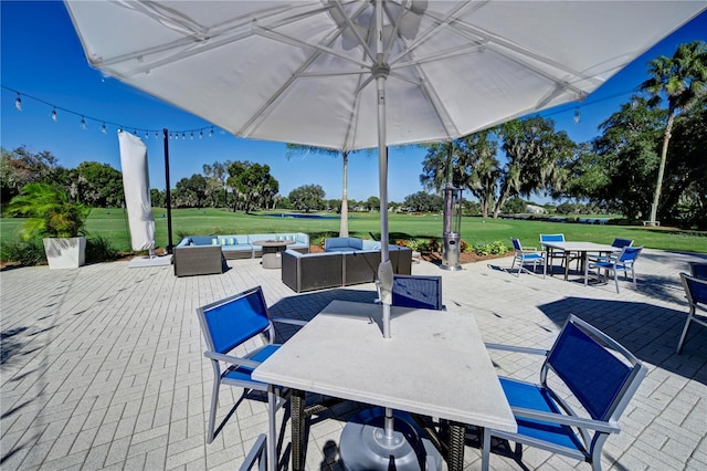 view of patio with outdoor dining area and an outdoor living space