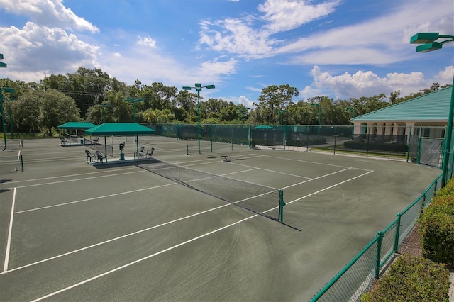 view of sport court with fence