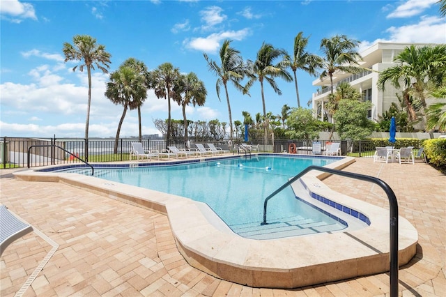 view of swimming pool with a patio