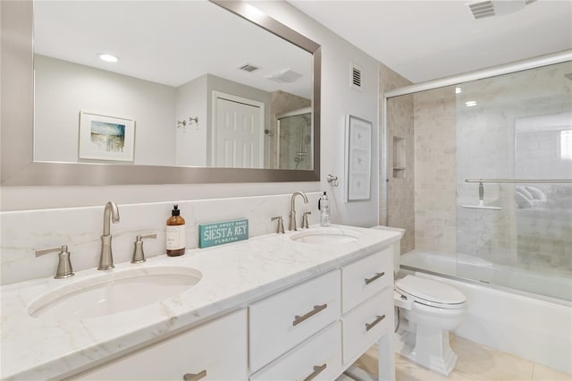 full bathroom featuring tile patterned flooring, vanity, backsplash, toilet, and combined bath / shower with glass door