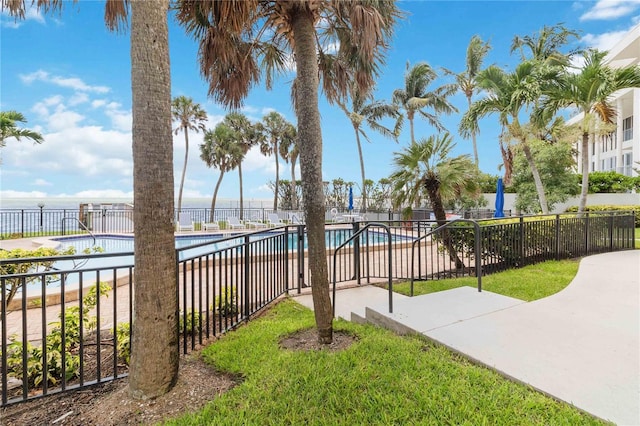 view of yard with a patio area and a community pool