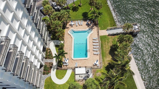 birds eye view of property with a water view