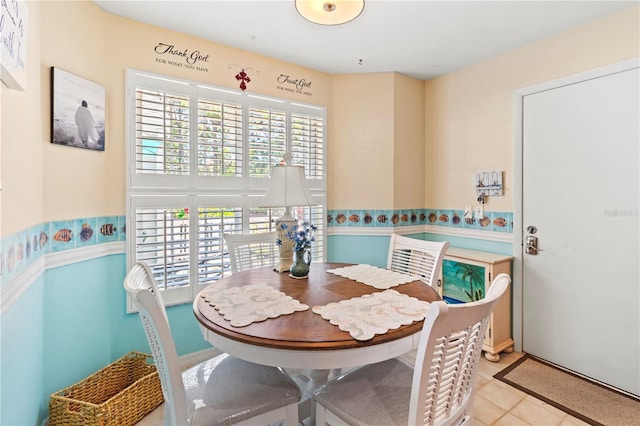 dining space with light tile patterned flooring