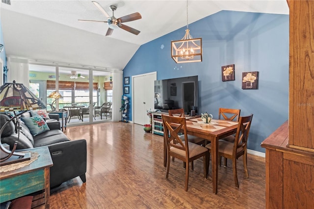 dining room featuring high vaulted ceiling, baseboards, wood finished floors, and ceiling fan with notable chandelier