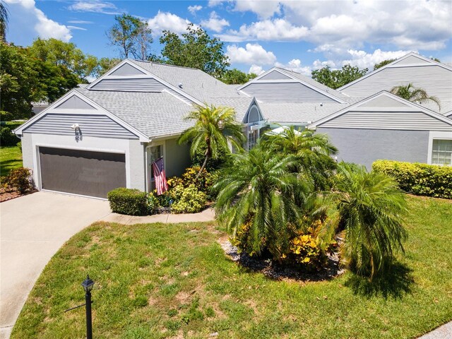 view of front facade featuring a garage and a front yard