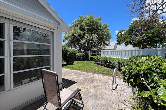 view of patio featuring fence