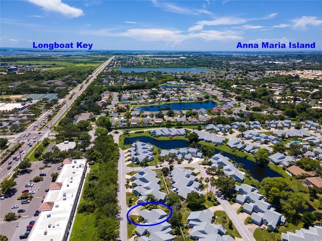 aerial view featuring a water view and a residential view