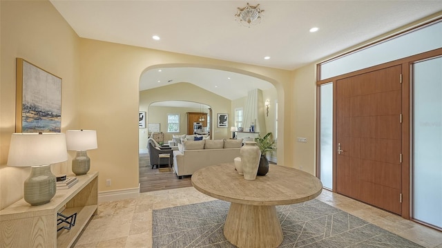 foyer entrance featuring lofted ceiling